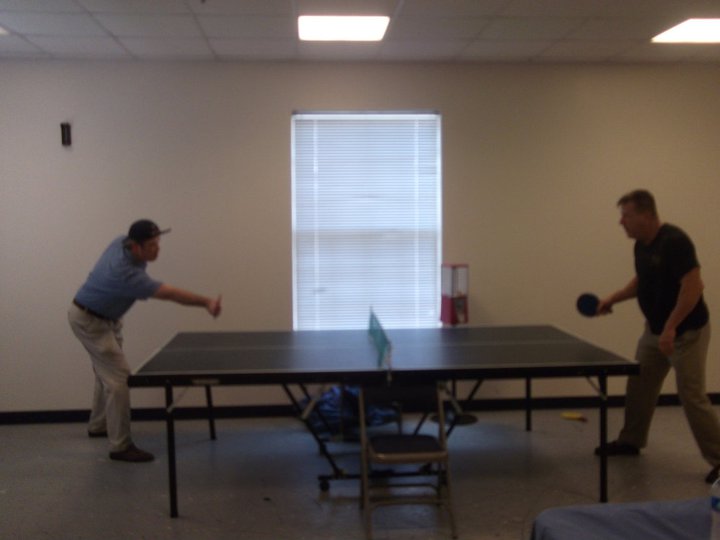 Priest Scott playing ping pong